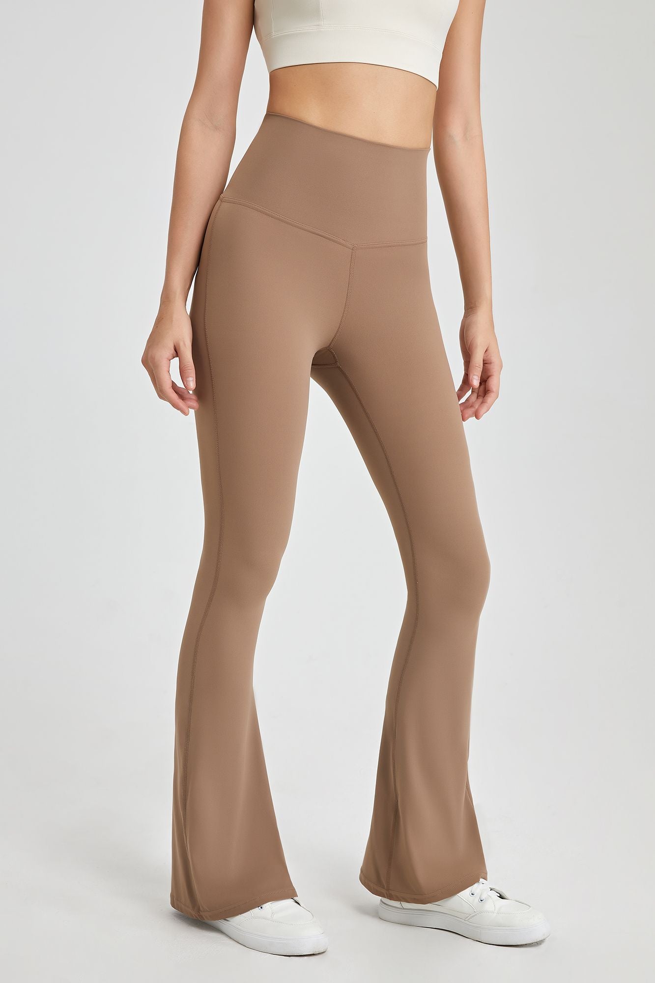 https://zioccie.com/cdn/shop/products/womens-high-rise-flare-leggings-with-rear-cross-cutout_3.jpg?v=1664294327