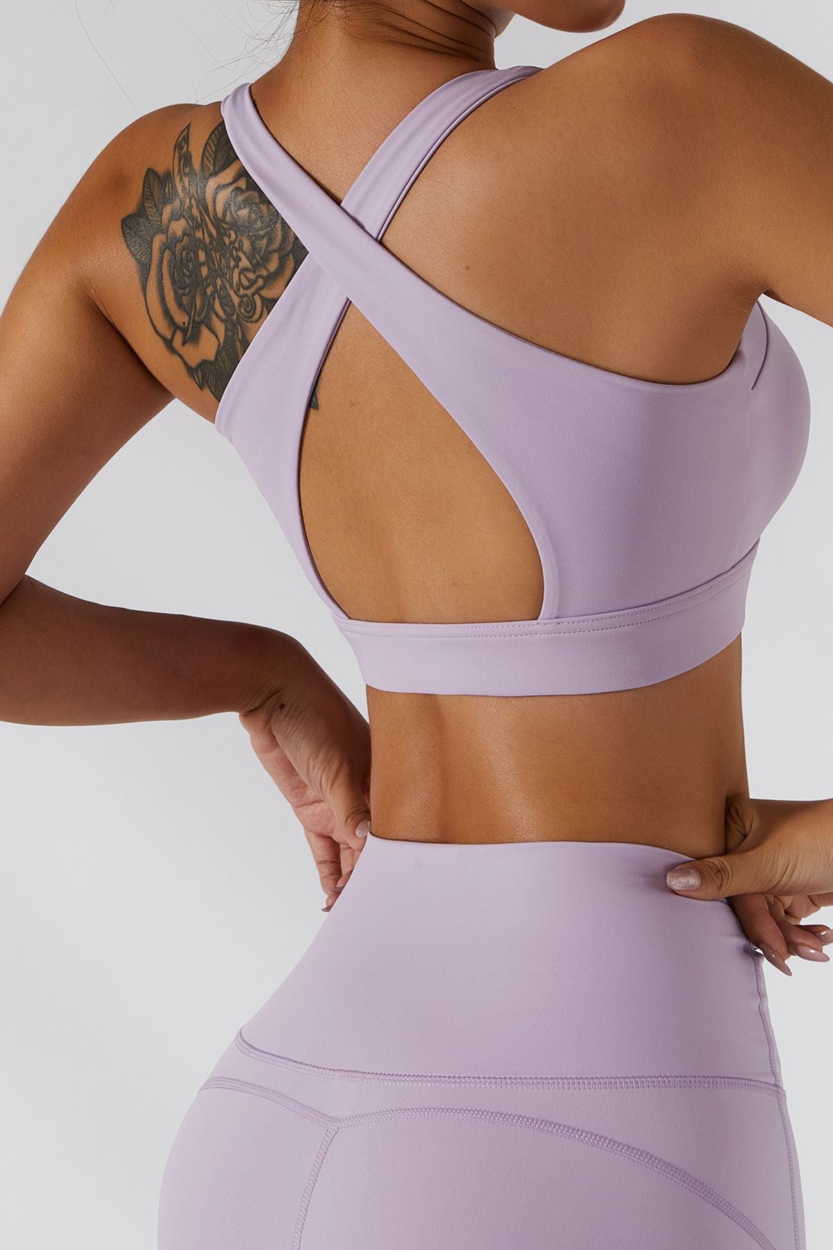 https://zioccie.com/cdn/shop/products/zipper-front-tops-crossover-straight-straps-sports-bra-light-to-medium-support-lilac_4.jpg?v=1655717878